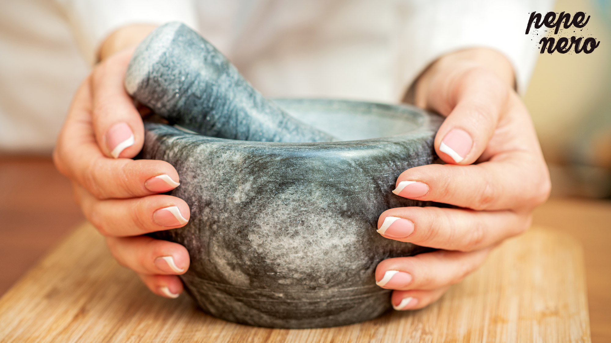 hands on marble granite mortar and pestle