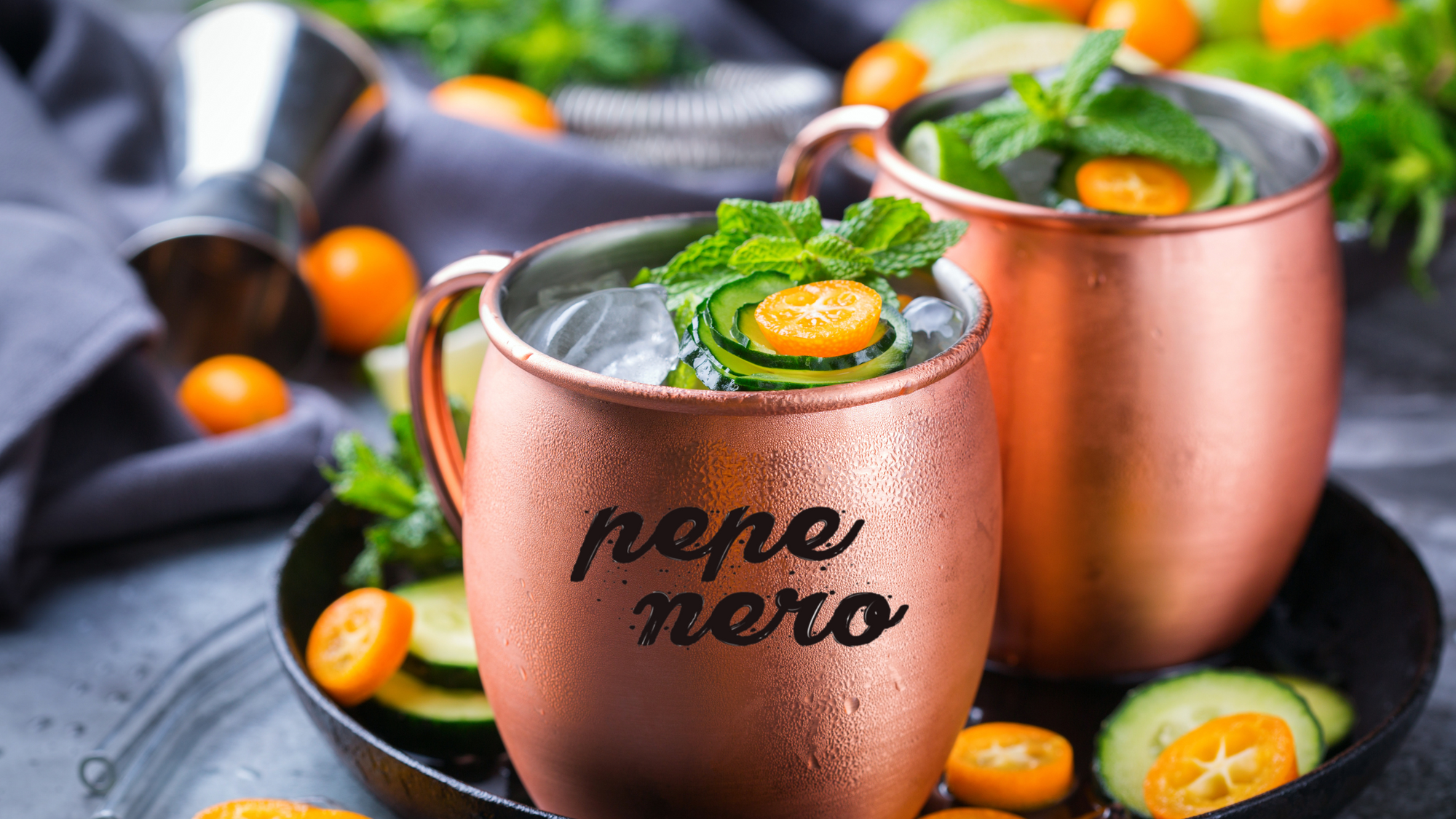 A moscow mule in a copper bup with mint as a garnish