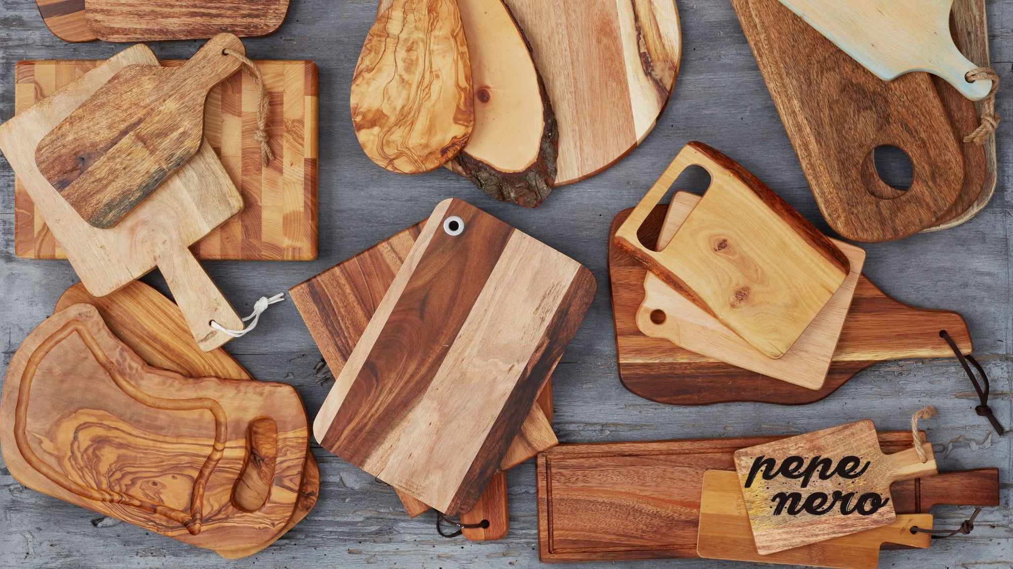 A variety of different shapes and sizes of wooden chopping boards