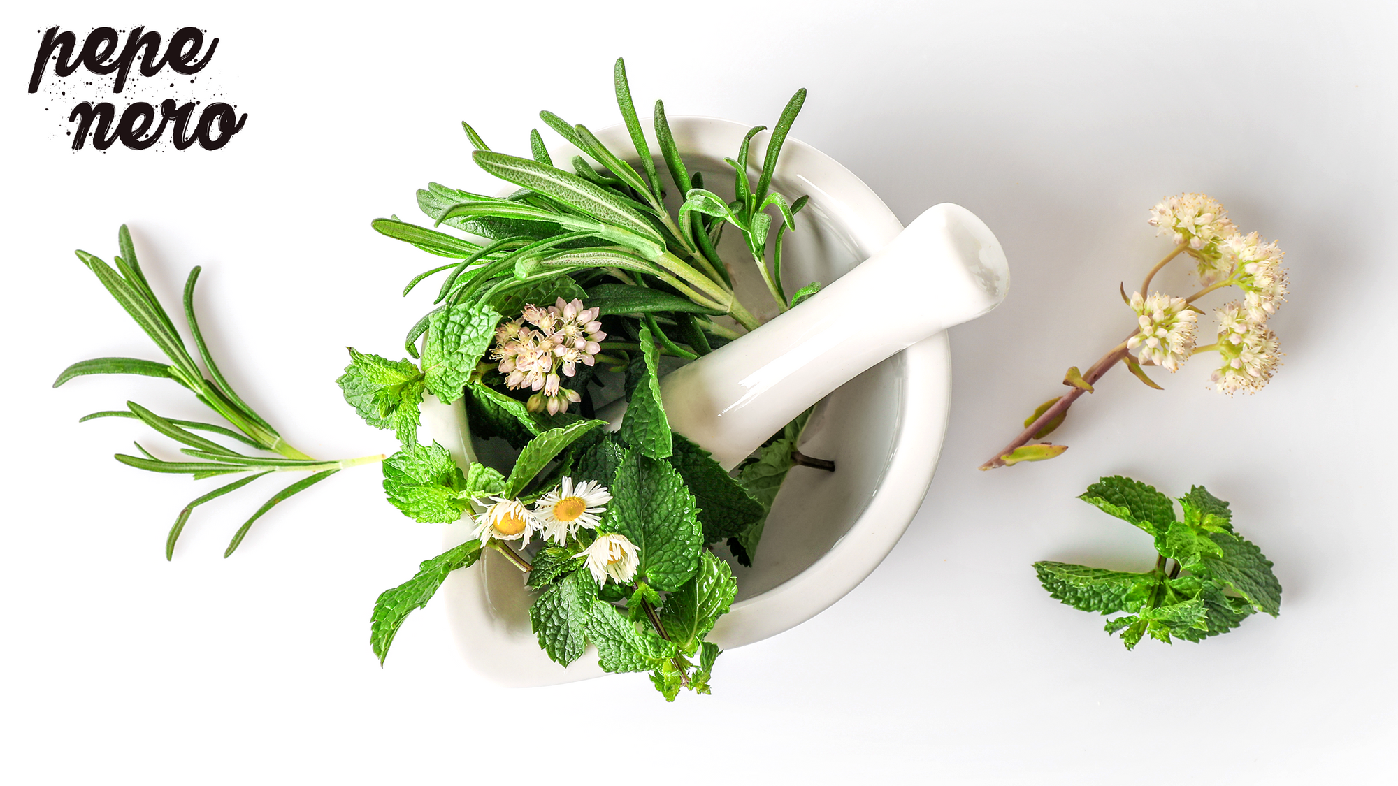 white mortar and pestle with leaves and flowers